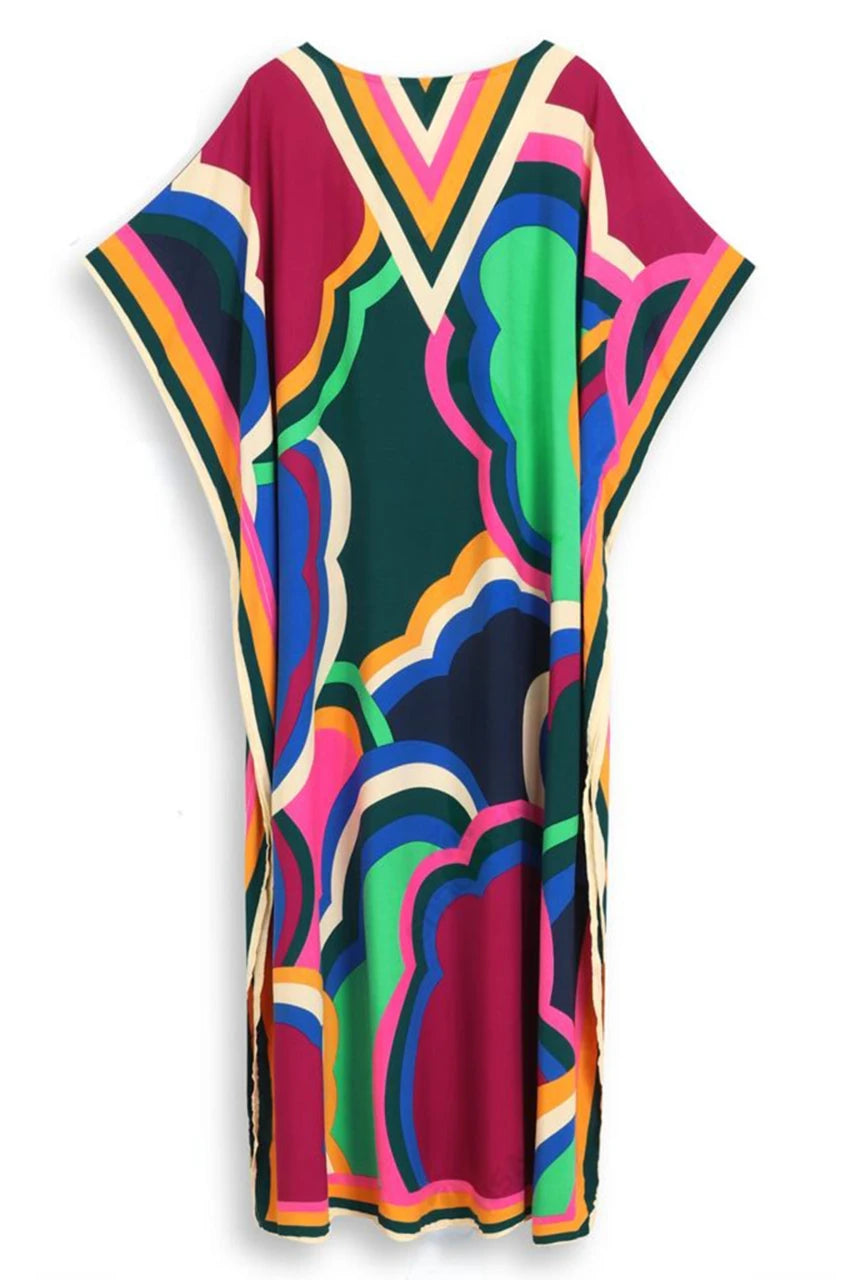 Flat lay back view of Novah Purple Tropical Kaftan with wide sleeves and tropical design