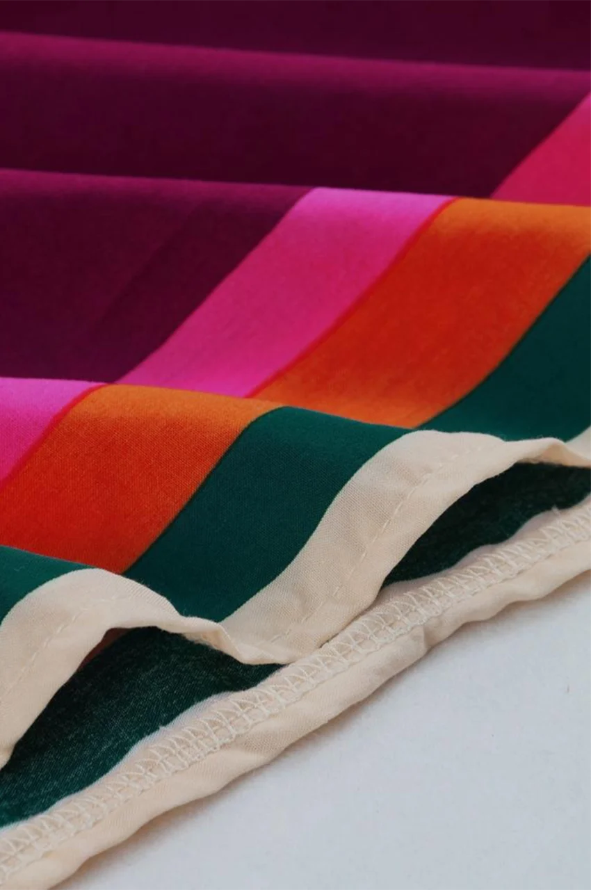 Front view of Novah Purple Tropical Kaftan with vibrant tropical print