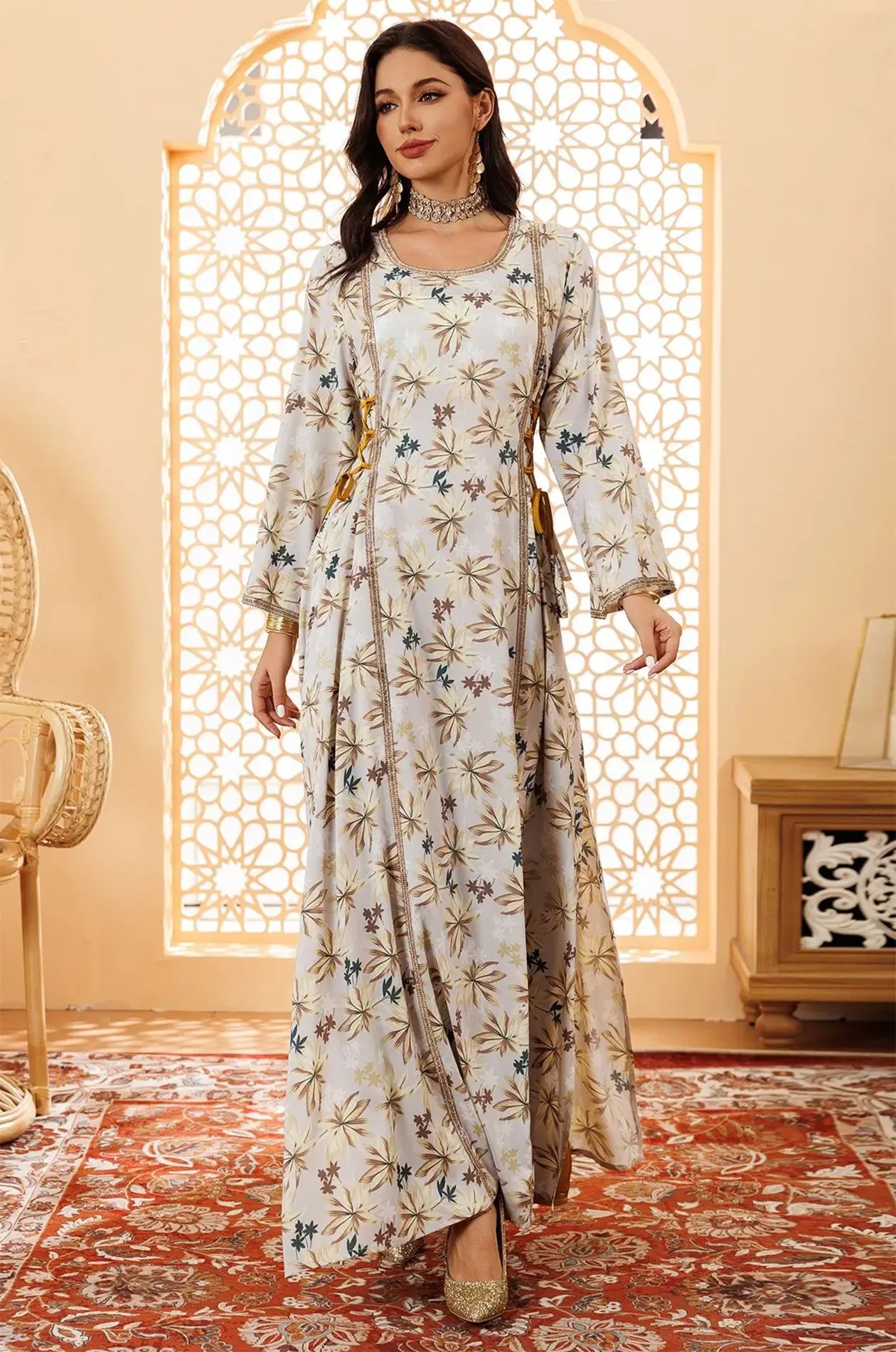 Full-length walking shot of the Nysria earthy floral maxi dress.