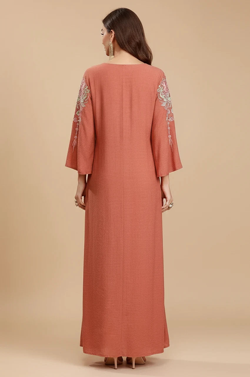 Back view of the Oraya kaftan showing textured fabric and sleeve details.