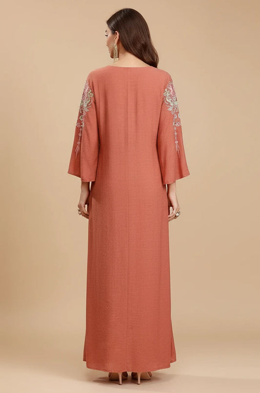 Back view of the Oraya kaftan showing textured fabric and sleeve details.