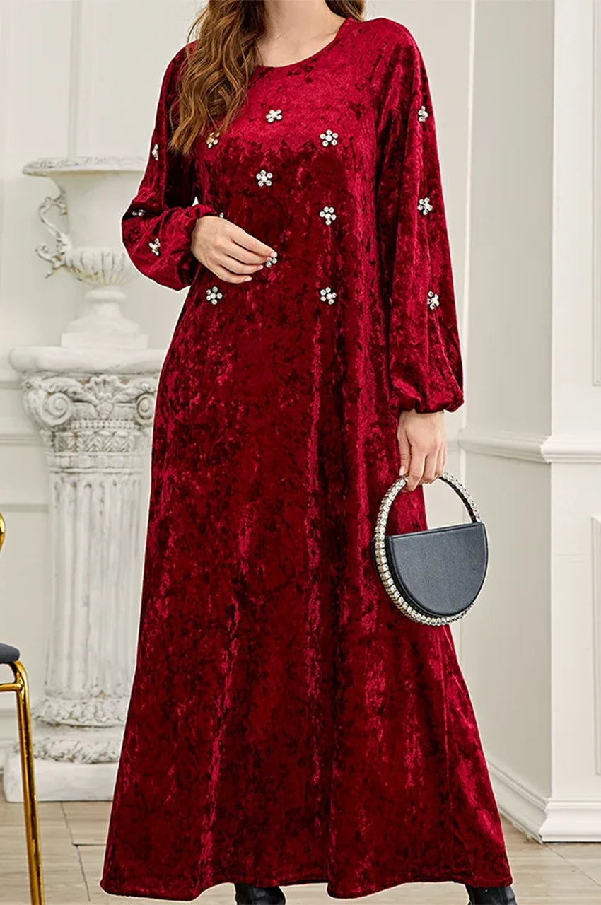 Close-up of crystal flower details on the bodice of the ruby kaftan dress.