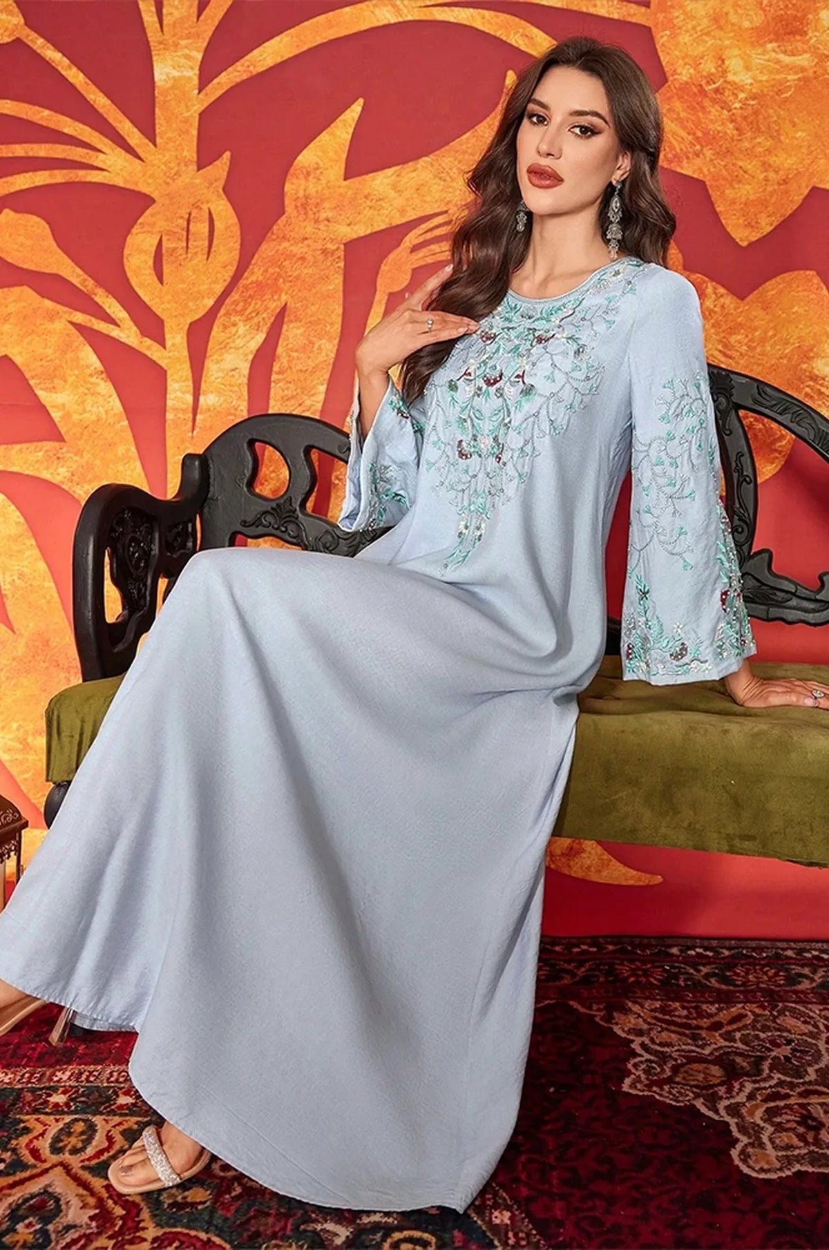 Highlighting the lightweight and fluid movement of the Petra kaftan fabric.