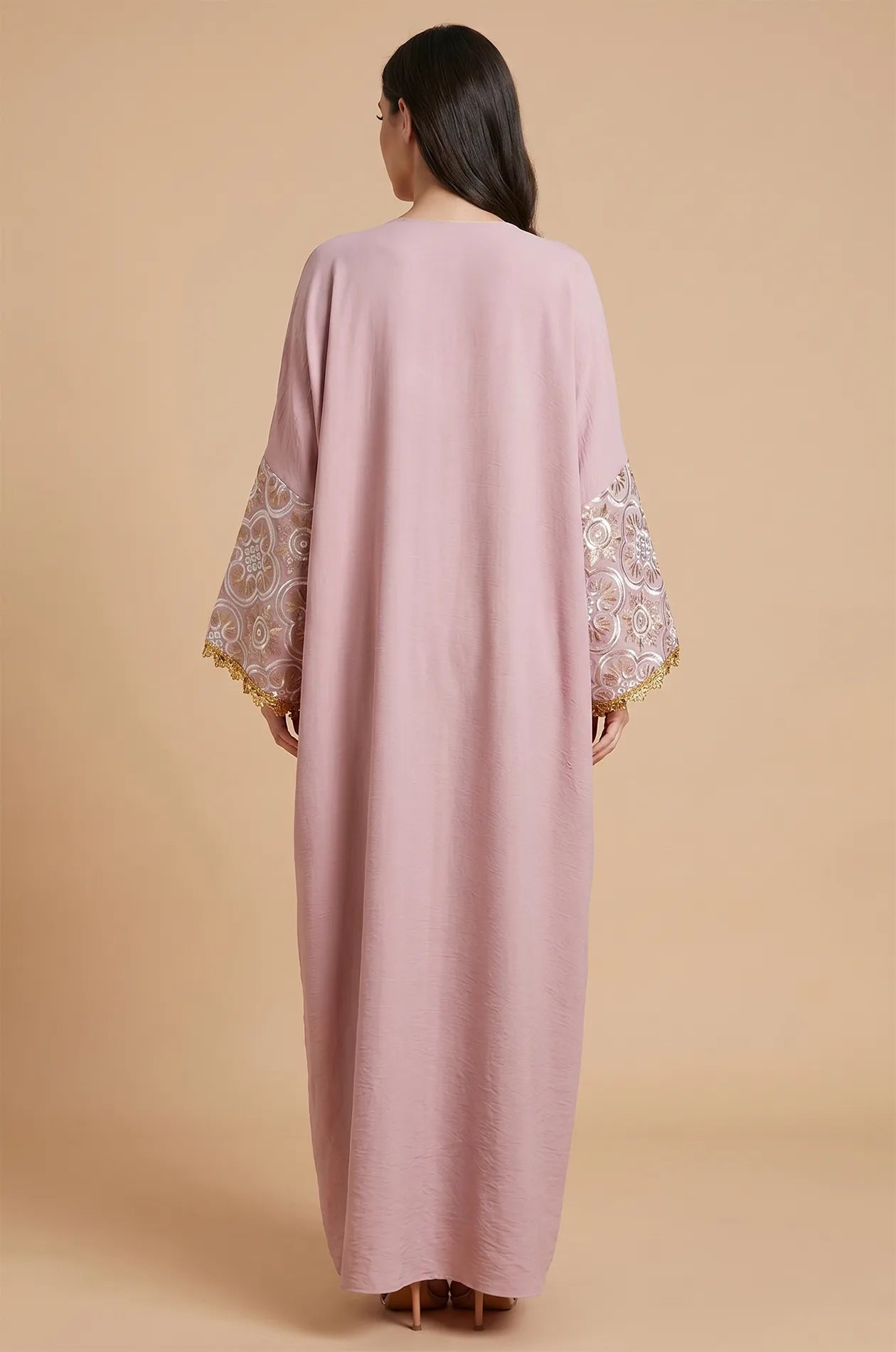 The back view of the pink Novae crepe kaftan, illustrating the smooth drape and premium fabric quality.