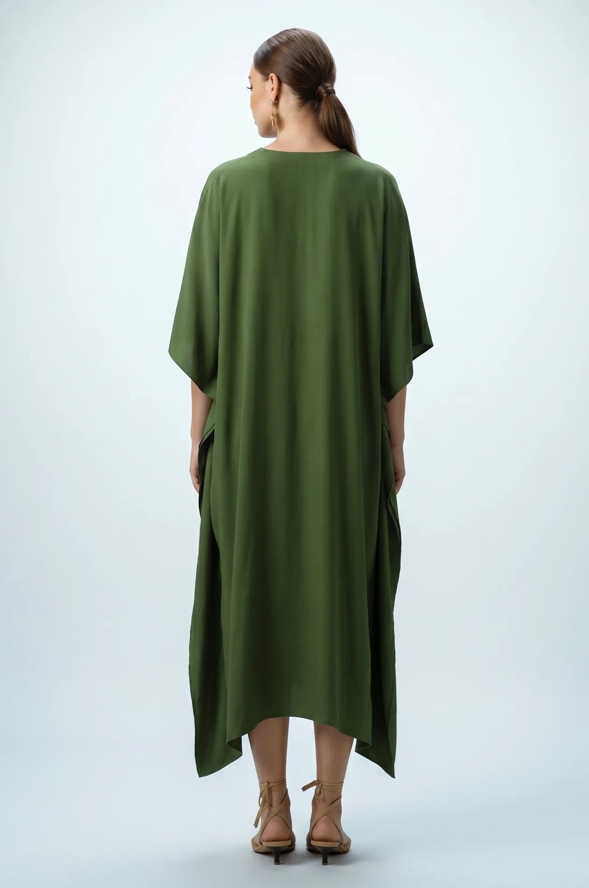 Back view of olive green plain maxi kaftan with draped hem