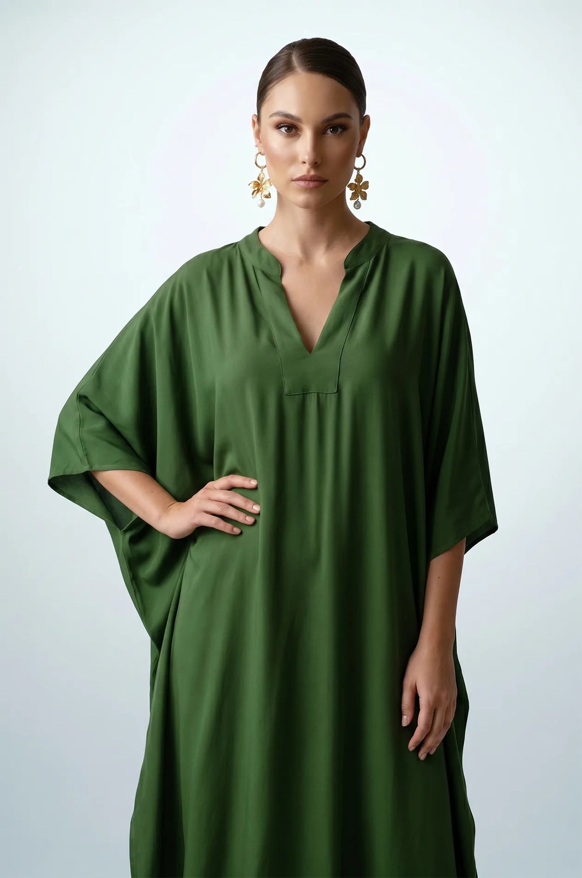 Front detail of olive green plain kaftan with split V-neckline