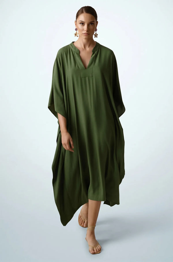 Woman walking in olive green plain kaftan with kimono sleeves