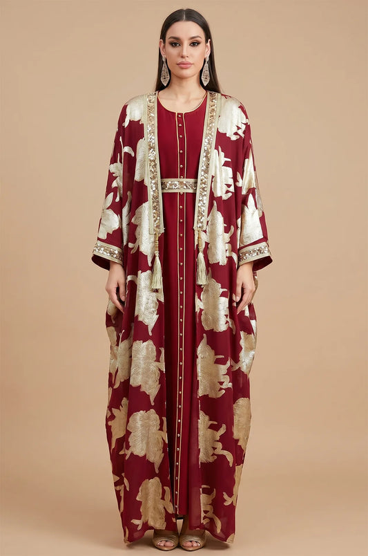 Direct front view of the red Puppis kaftan luxe featuring metallic gold floral embroidery and a shimmering sequined belt.