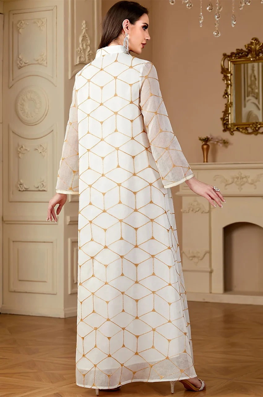 Angled back view of the Rahel kaftan showing sheer sleeve fabric and drape.