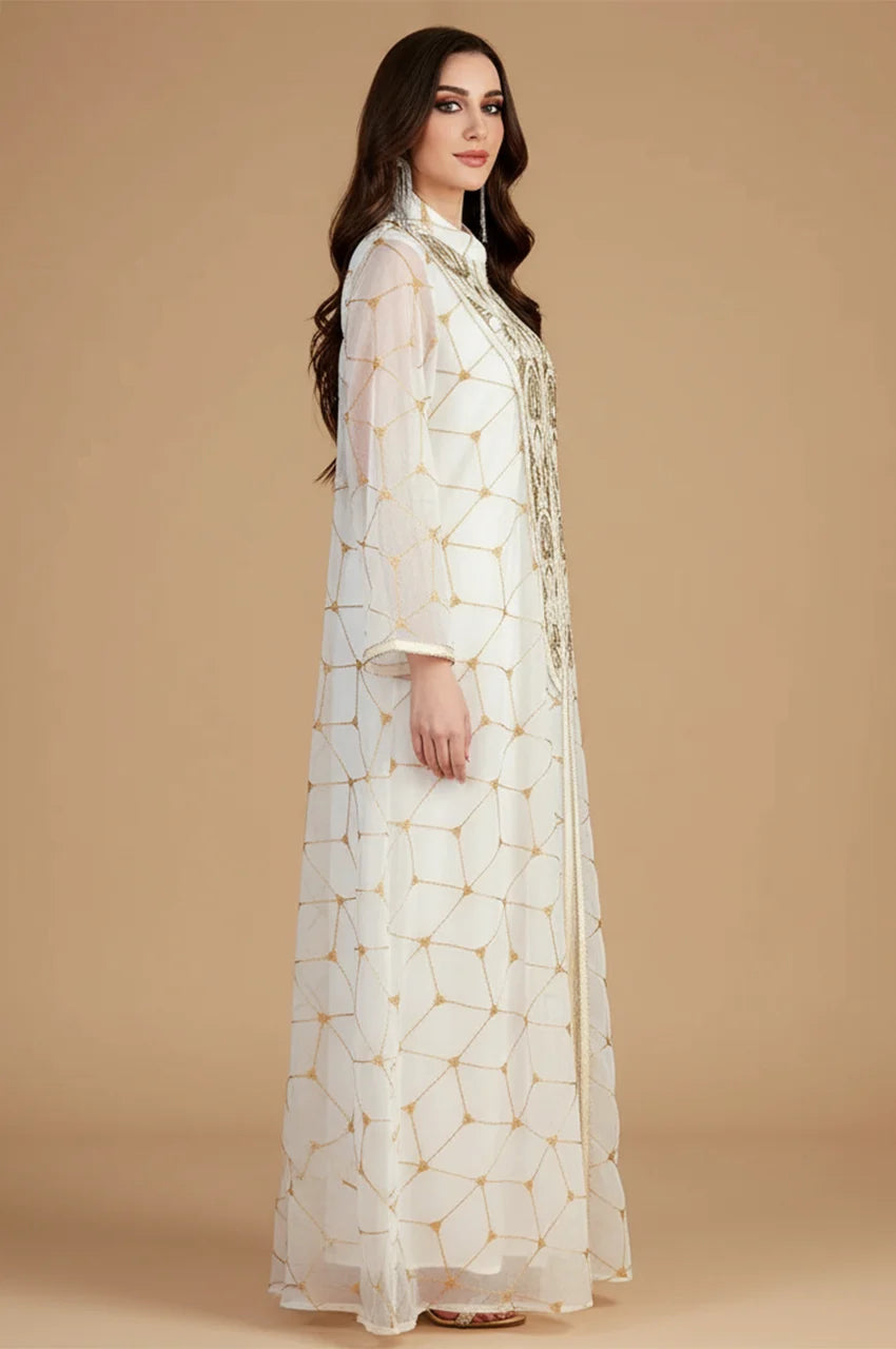 Side profile of woman in Rahel white kaftan showing A-line silhouette and sleeve length.