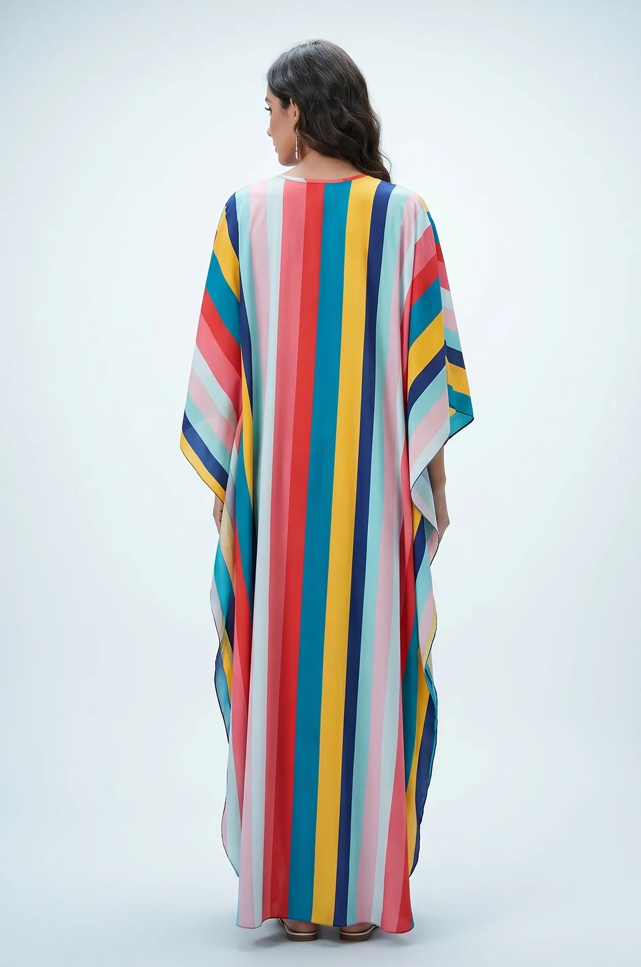 Studio back view of multicolor rainbow striped beach kaftan