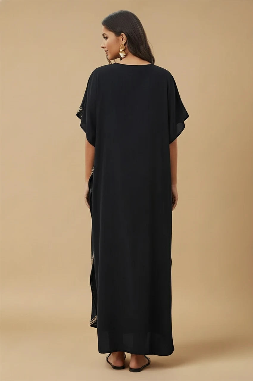 Model showing back of Ralia black embroidered kaftan