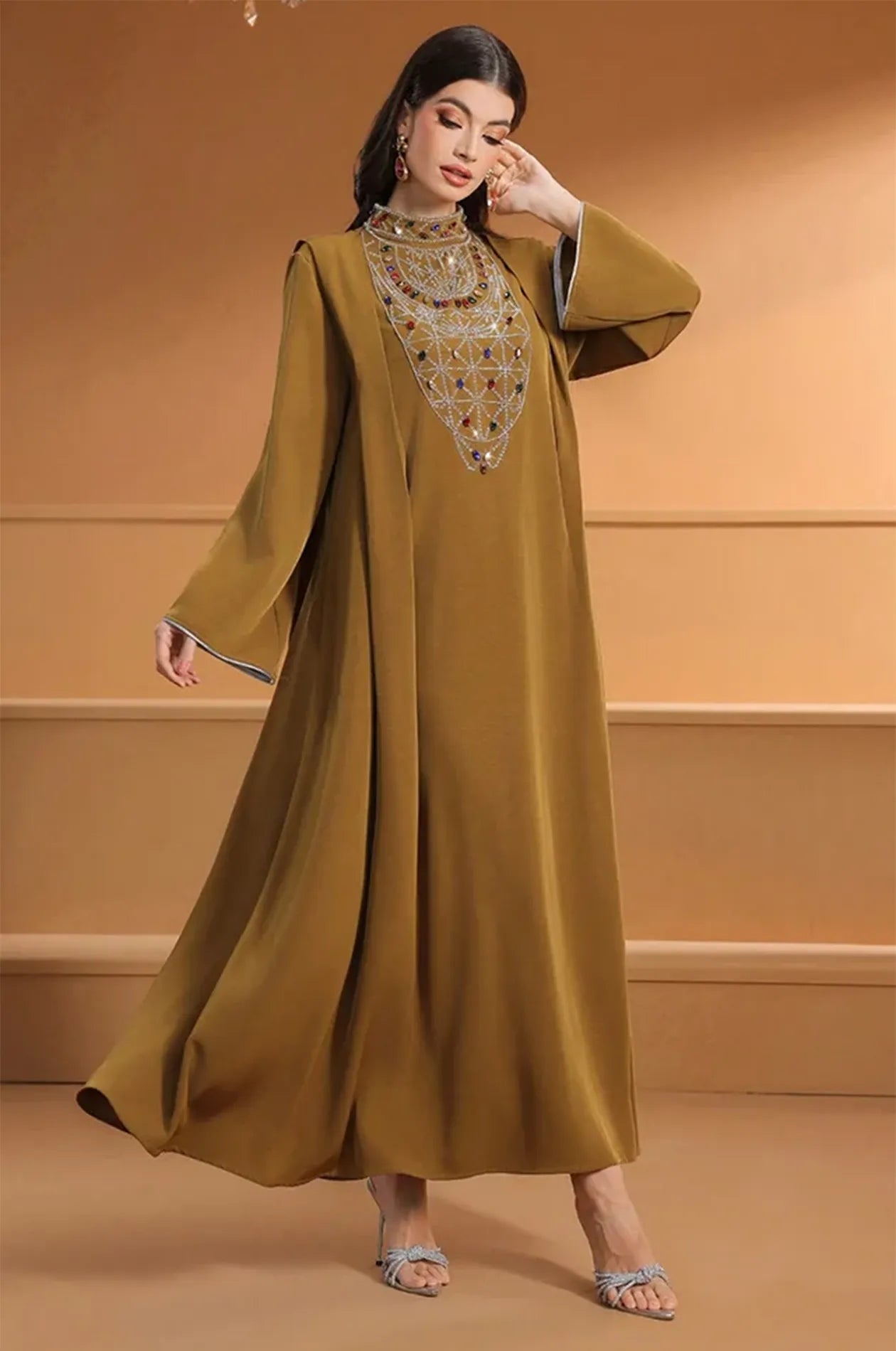 Full-length fashion shot of the Rami crystal kaftan for luxury evening wear.