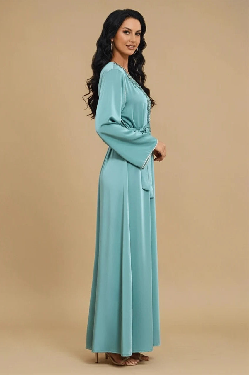 Ranya light blue cotton long kaftan shown from the side with belted waist