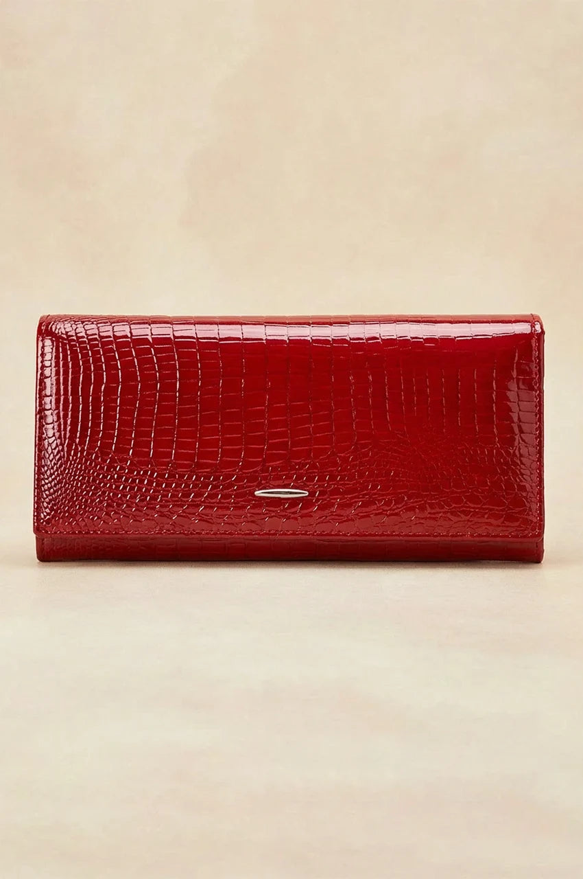Front view of the red crocodile embossed patent leather long wallet with silver logo accent.