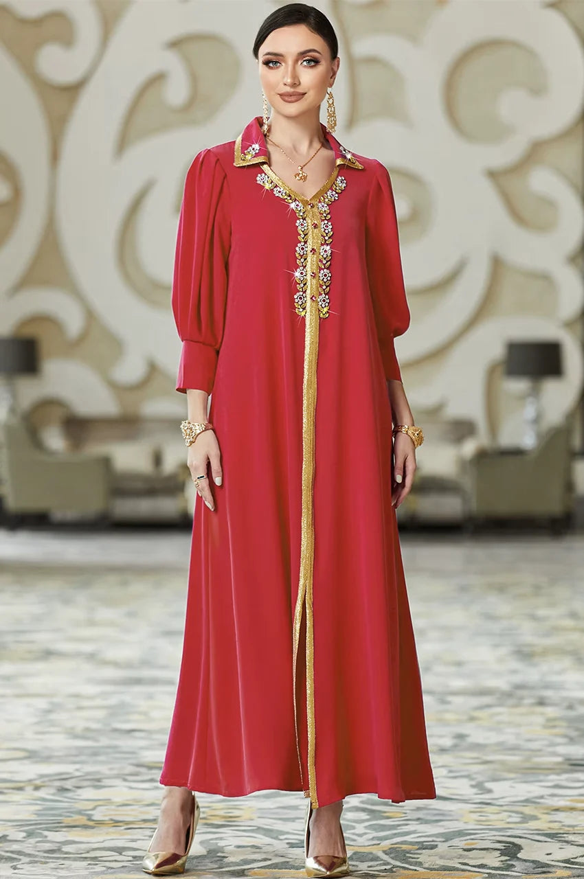 Karia red modest kaftan robe with gold embroidery and bishop sleeves, front view on model.
