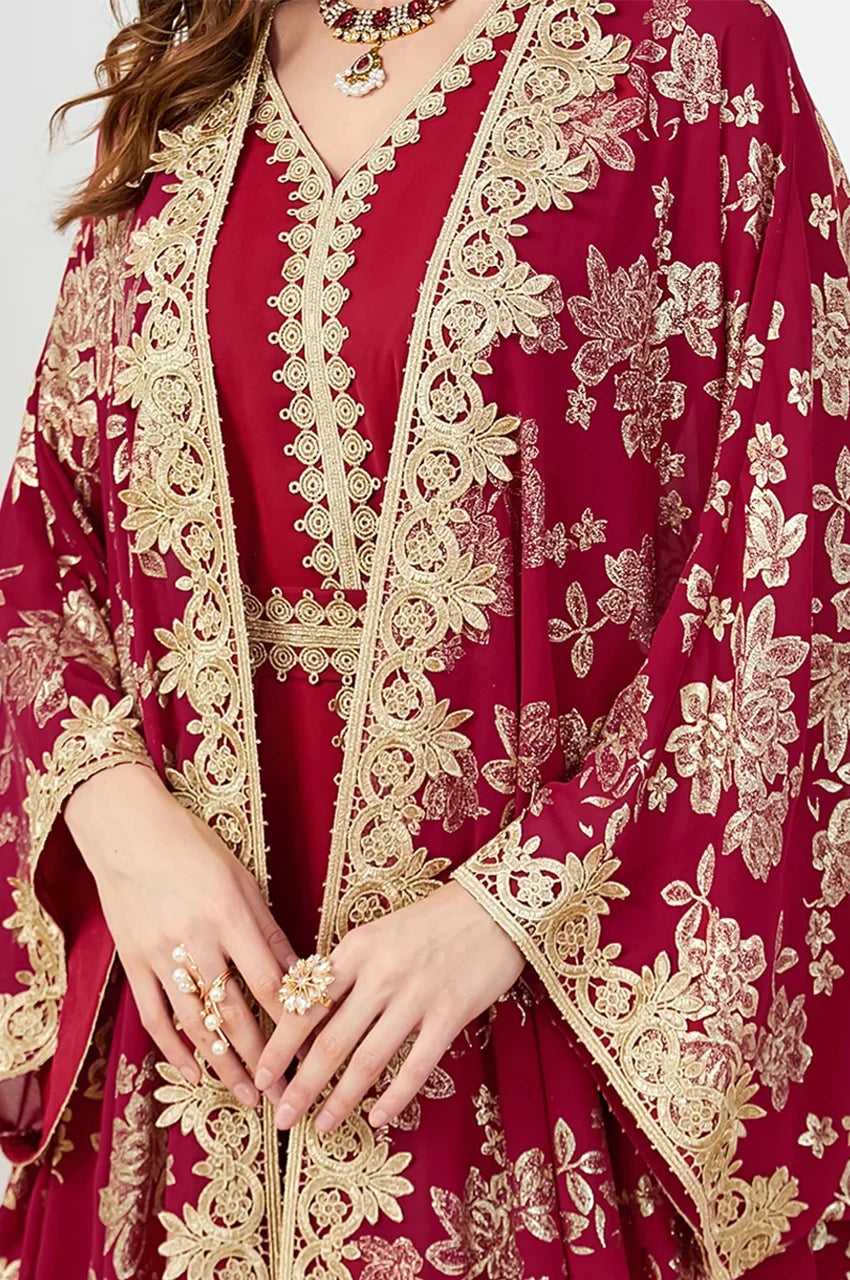 Close-up of the gold Sfifa trim and sleeve embroidery on the red floral print kaftan dress.