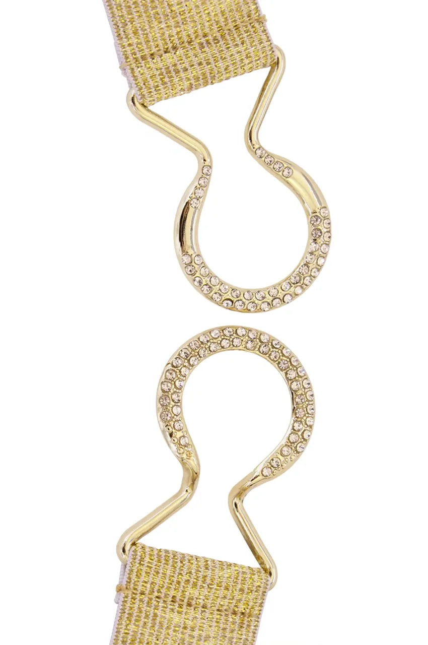 Detail shot showing the open interlocking mechanism of the gold rhinestone belt buckle.
