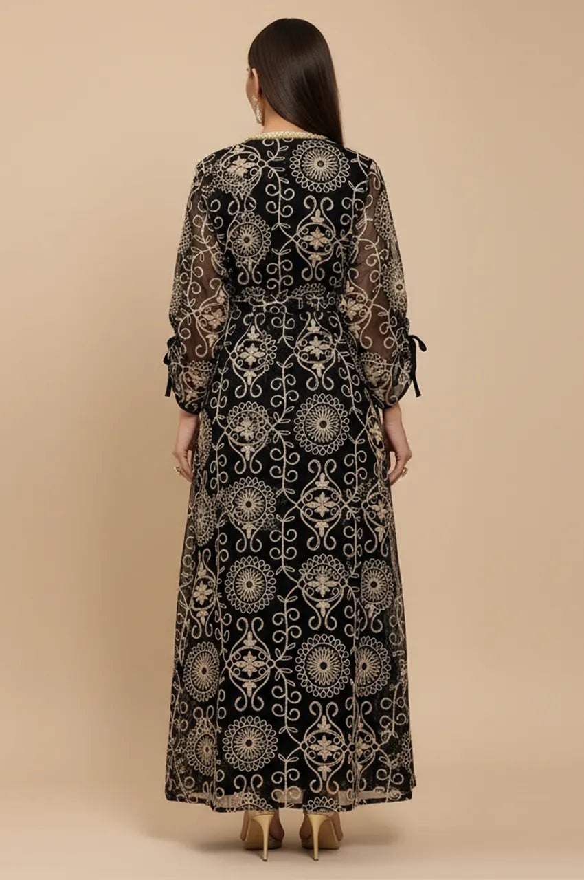 Back view of the floor-length RIYAA black chiffon kaftan showing the high neckline.