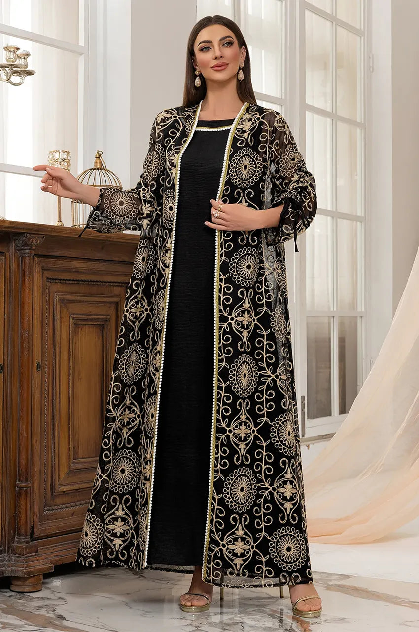 Lifestyle shot of the RIYAA black chiffon kaftan styled as a high-fashion evening gown for formal galas.