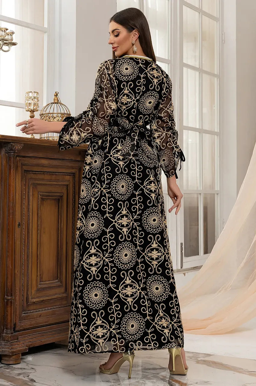 Close up of Riyaa kaftan gold embroidery texture and belt detail.