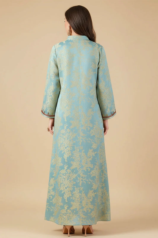 Back view of the Riyah kaftan showing the seamless flow of the floral jacquard fabric.