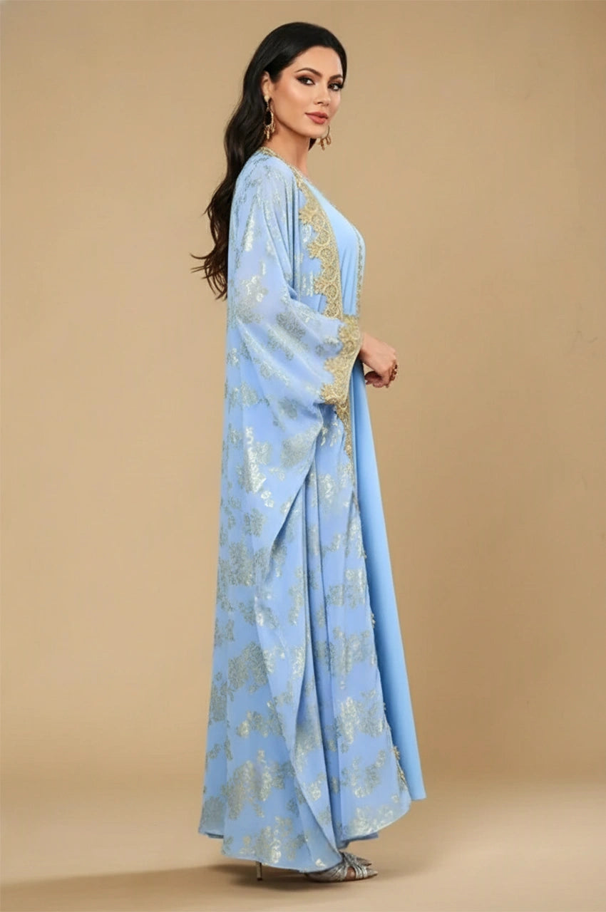 Side profile of the royal light blue floral print kaftan dress with embroidered borders.