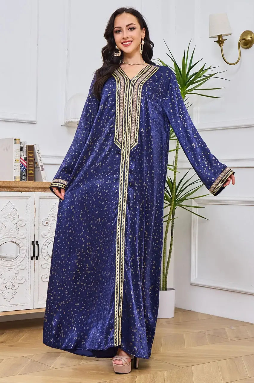 Angled front view of the Royal Blue Sabria kaftan highlighting gold accents.