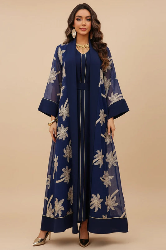 Full front view of SAELA dark blue palm tree kaftan showing gold embroidery on navy organza.