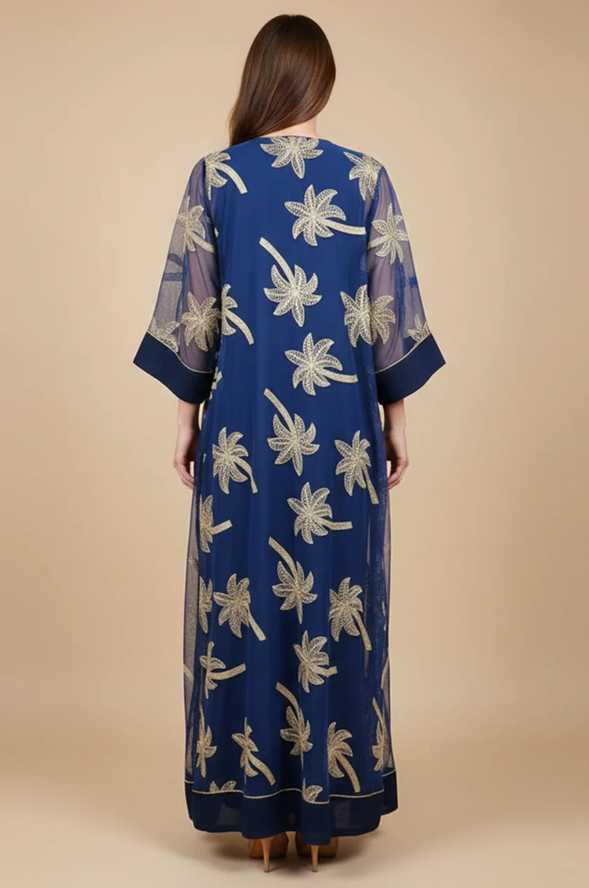 Back view of the SAELA dark blue palm tree kaftan highlighting the floor-length A-line drape.