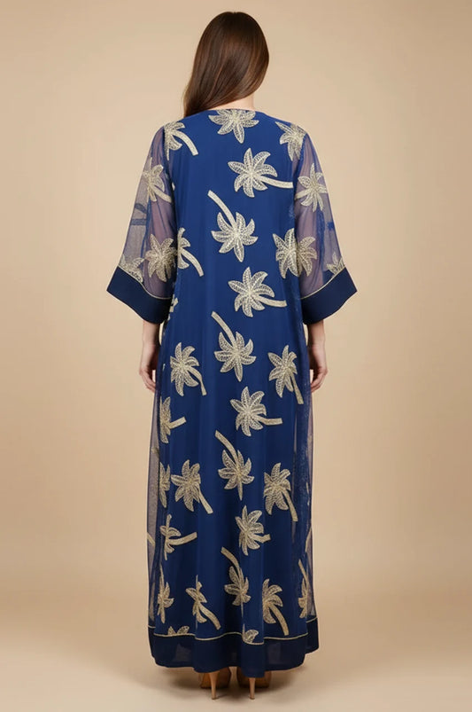 Back view of the SAELA dark blue palm tree kaftan highlighting the floor-length A-line drape.