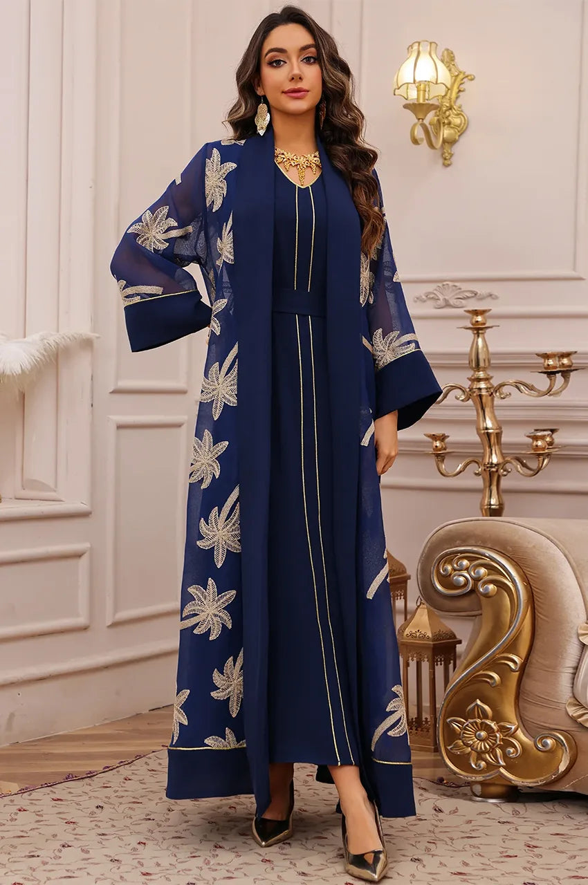 SAELA dark blue palm tree kaftan styled as a formal evening gown for weddings or galas.