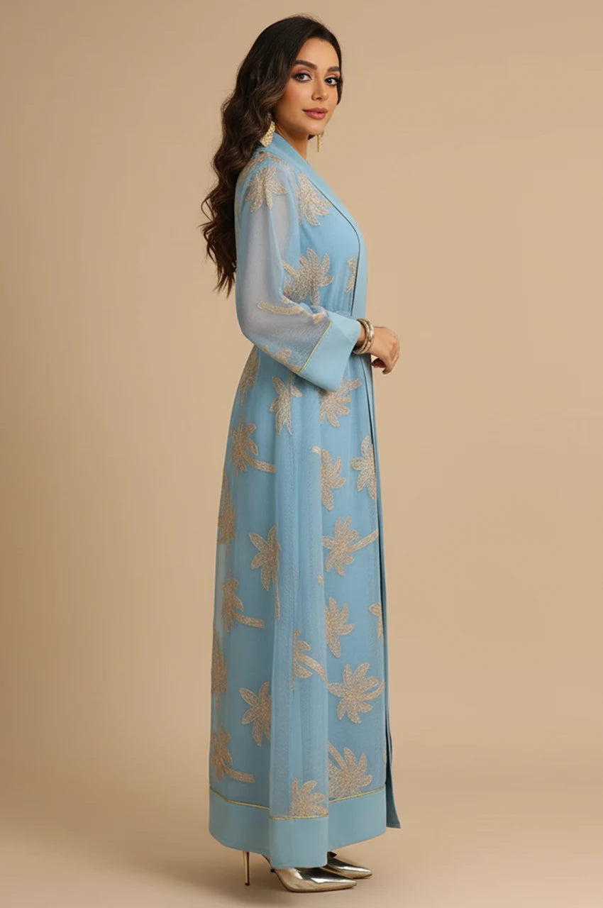 Side profile of the light blue palm tree kaftan highlighting the 2-piece layering and open-front structure.