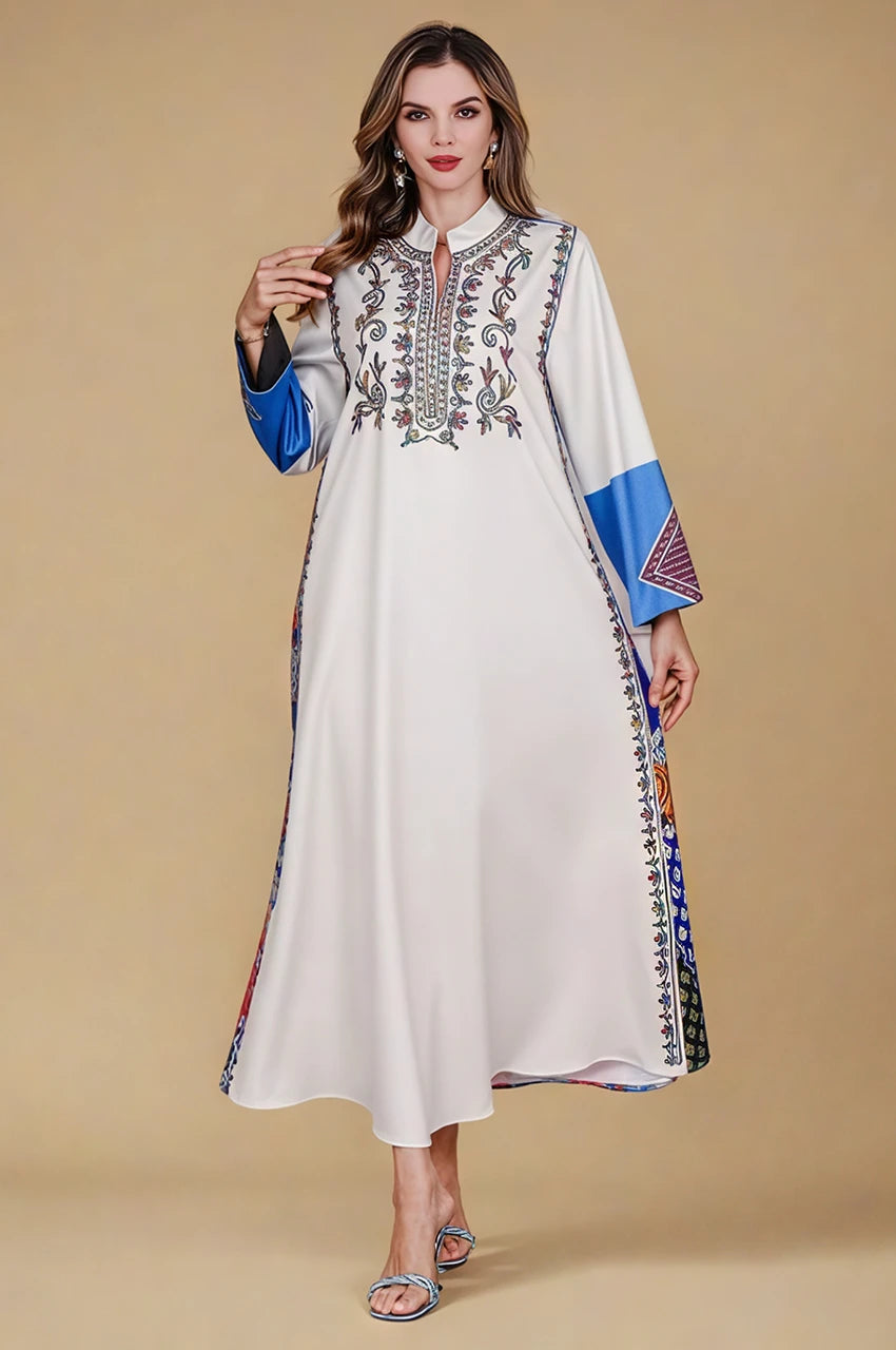 Woman wearing Safiya white embroidered kaftan with luxury neckline