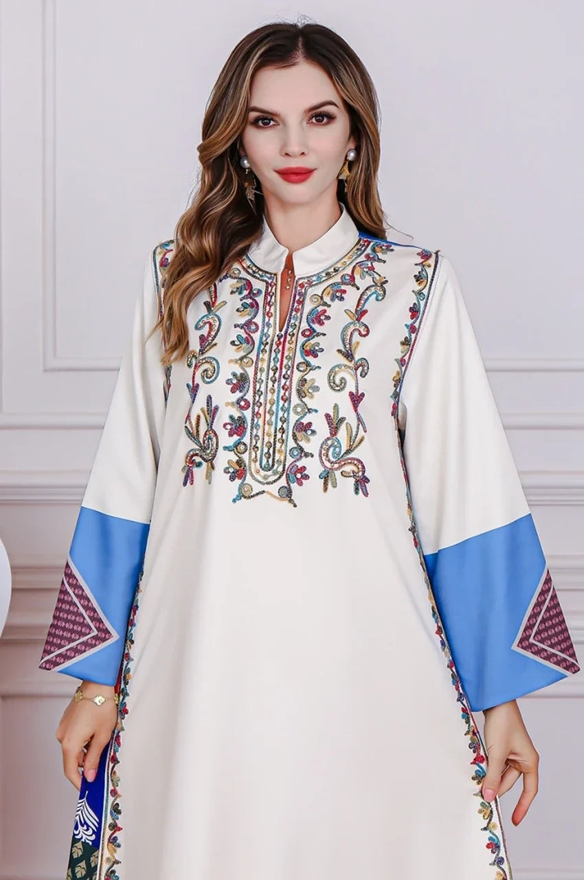 Front view of Safiya white embroidered kaftan with colorful detailing