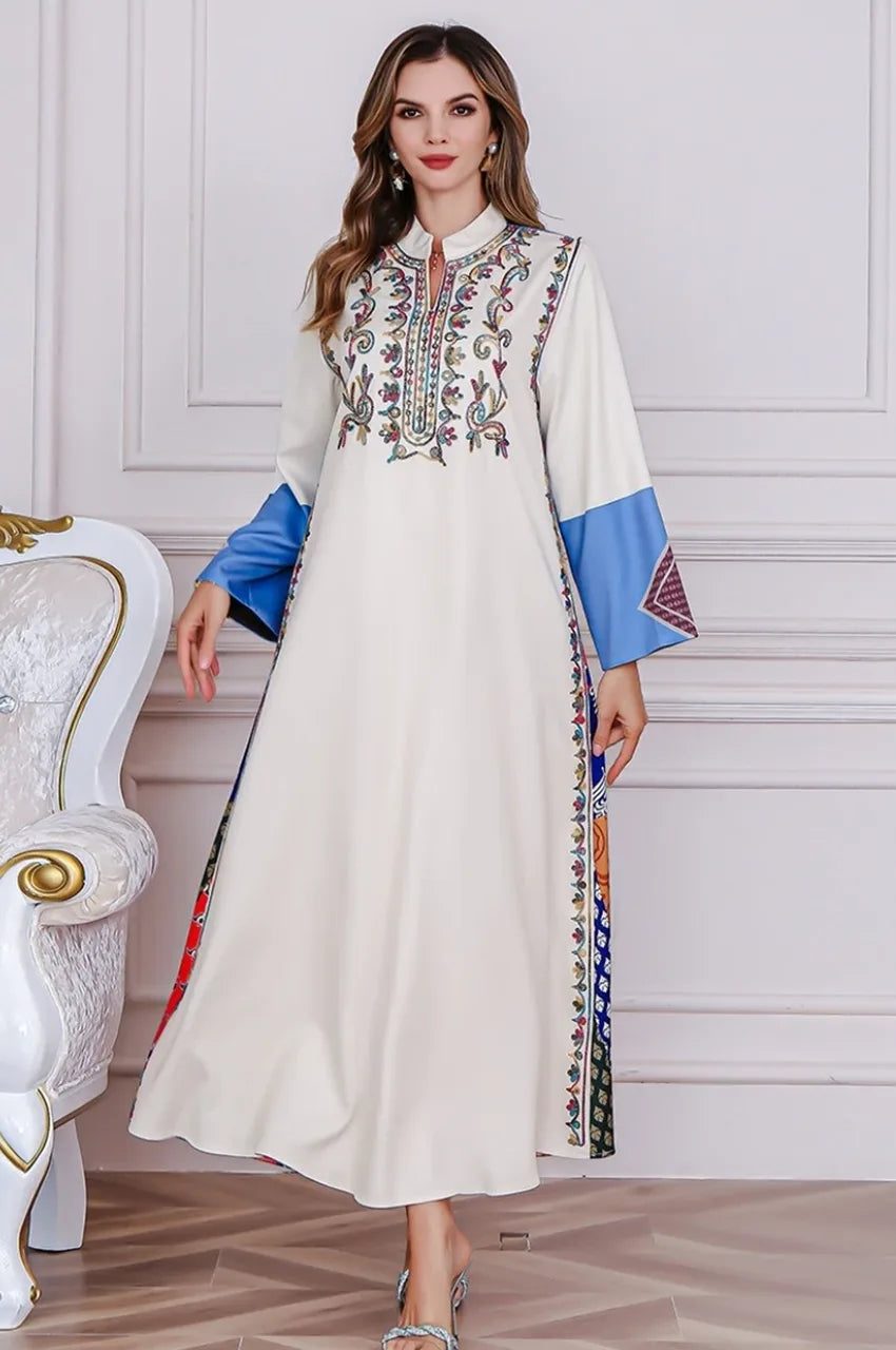 Flowing front view of Safiya white embroidered kaftan in motion
