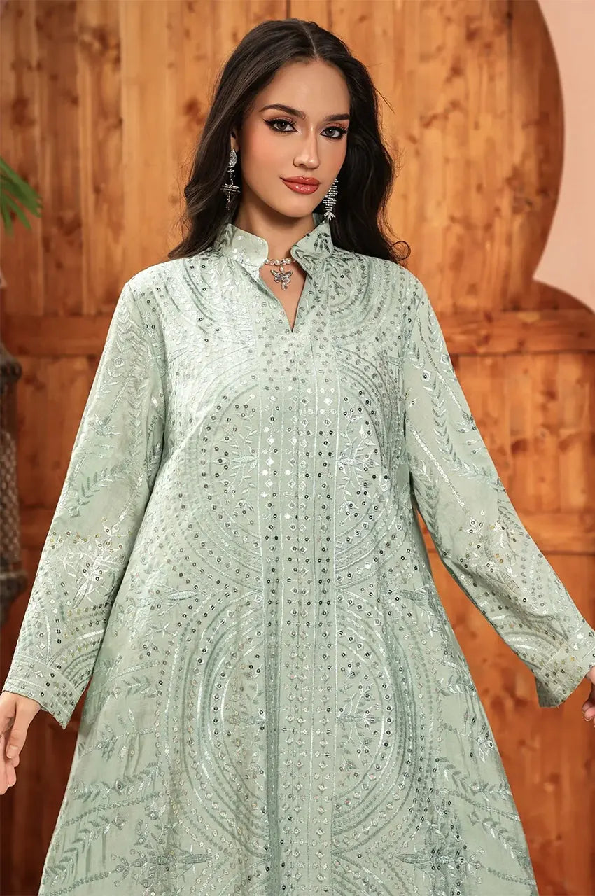 Close-up detail of the sequin embroidery and mandarin collar on the Maeli Kaftan.