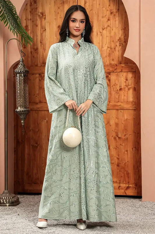 Frontal shot of the Maeli Kaftan styled with a decorative white spherical clutch bag.