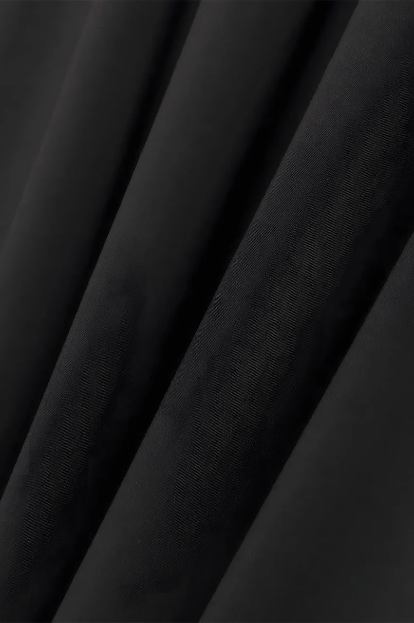 Close-up of lightweight black fabric used in SAHIRA Embroidered Beach Kaftan