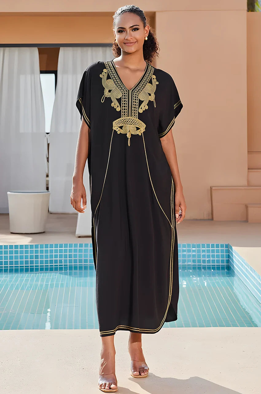 SAHIRA Black Embroidered Beach Kaftan styled by the pool in resort setting