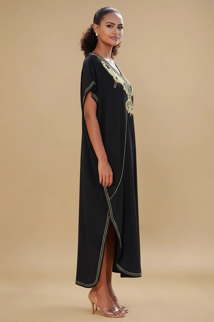 Side view of SAHIRA Black Embroidered Beach Kaftan showing slit and gold embroidery