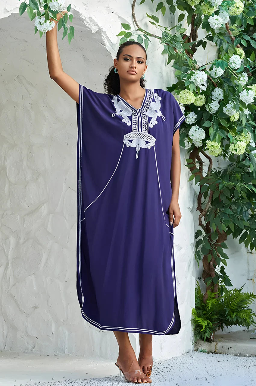 SAHIRA Blue Embroidered Beach Kaftan photographed in garden with floral background