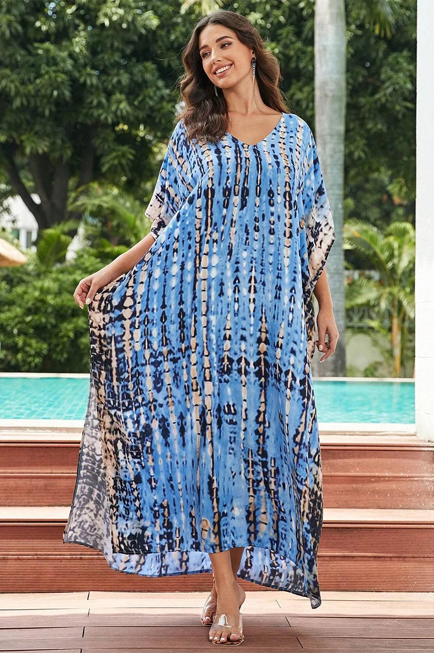 Model wearing Sahra Sky Blue Tie Dye Kaftan poolside in elegant resort setting