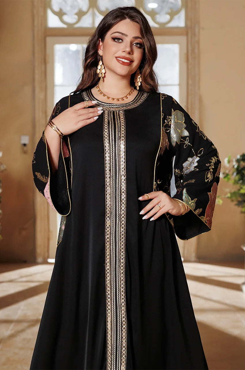Close-up of neckline on Samira Black Pakistan Kaftan with gold embroidery and metallic floral chiffon sleeves.