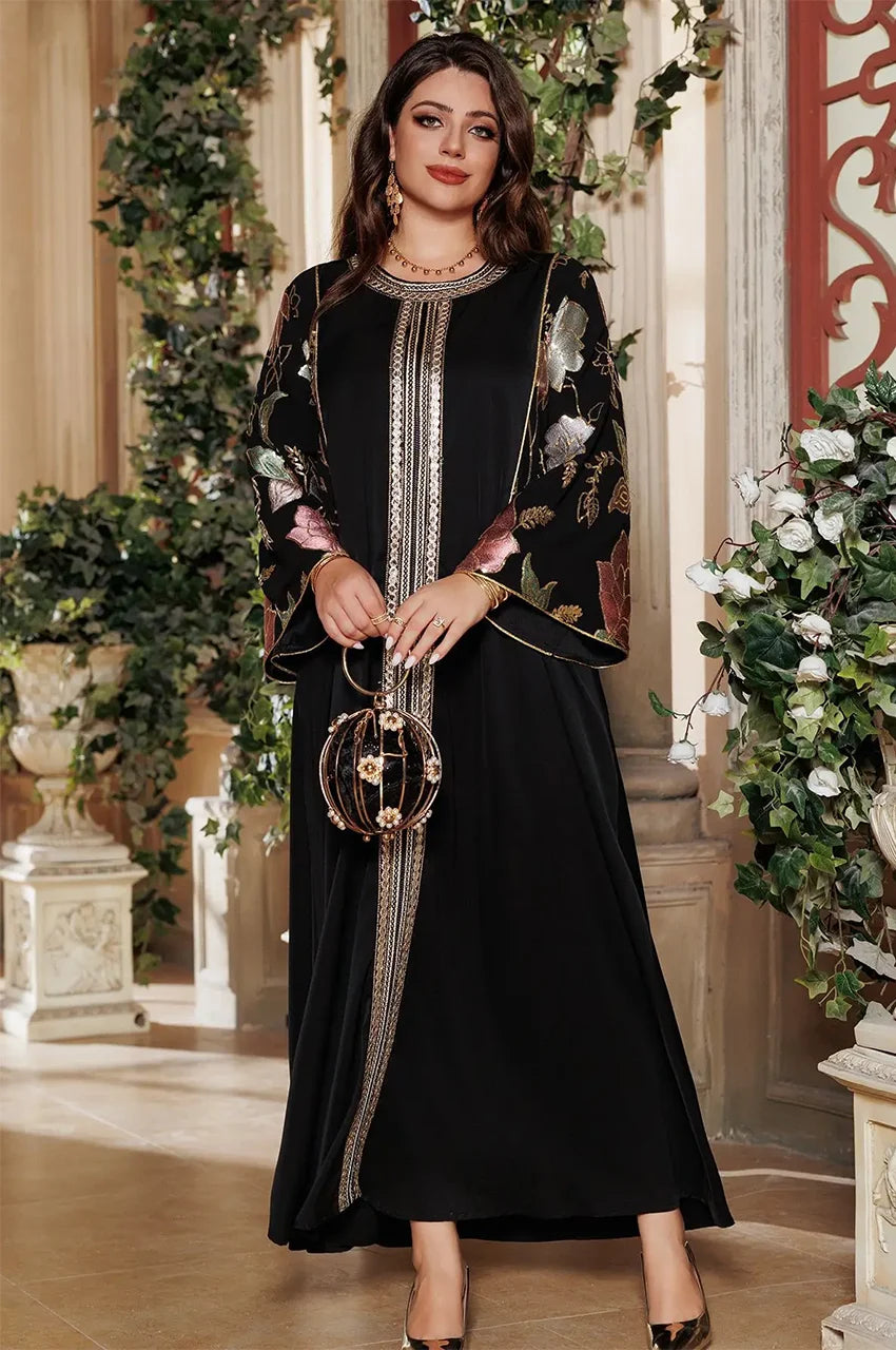 Luxury Samira Pakistan Kaftan in black, metallic floral sleeves and gold embroidery, full-length standing pose.
