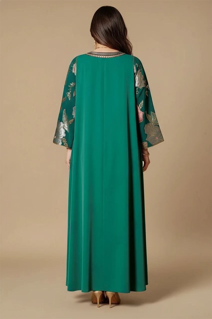 Back view of Samira green Pakistan kaftan with long flowing silhouette