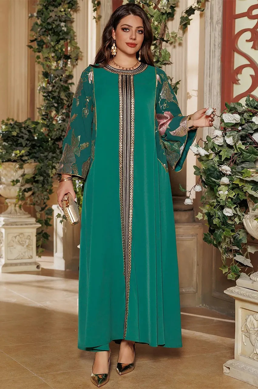 Elegant woman wearing Samira Green Pakistan Kaftan standing indoors