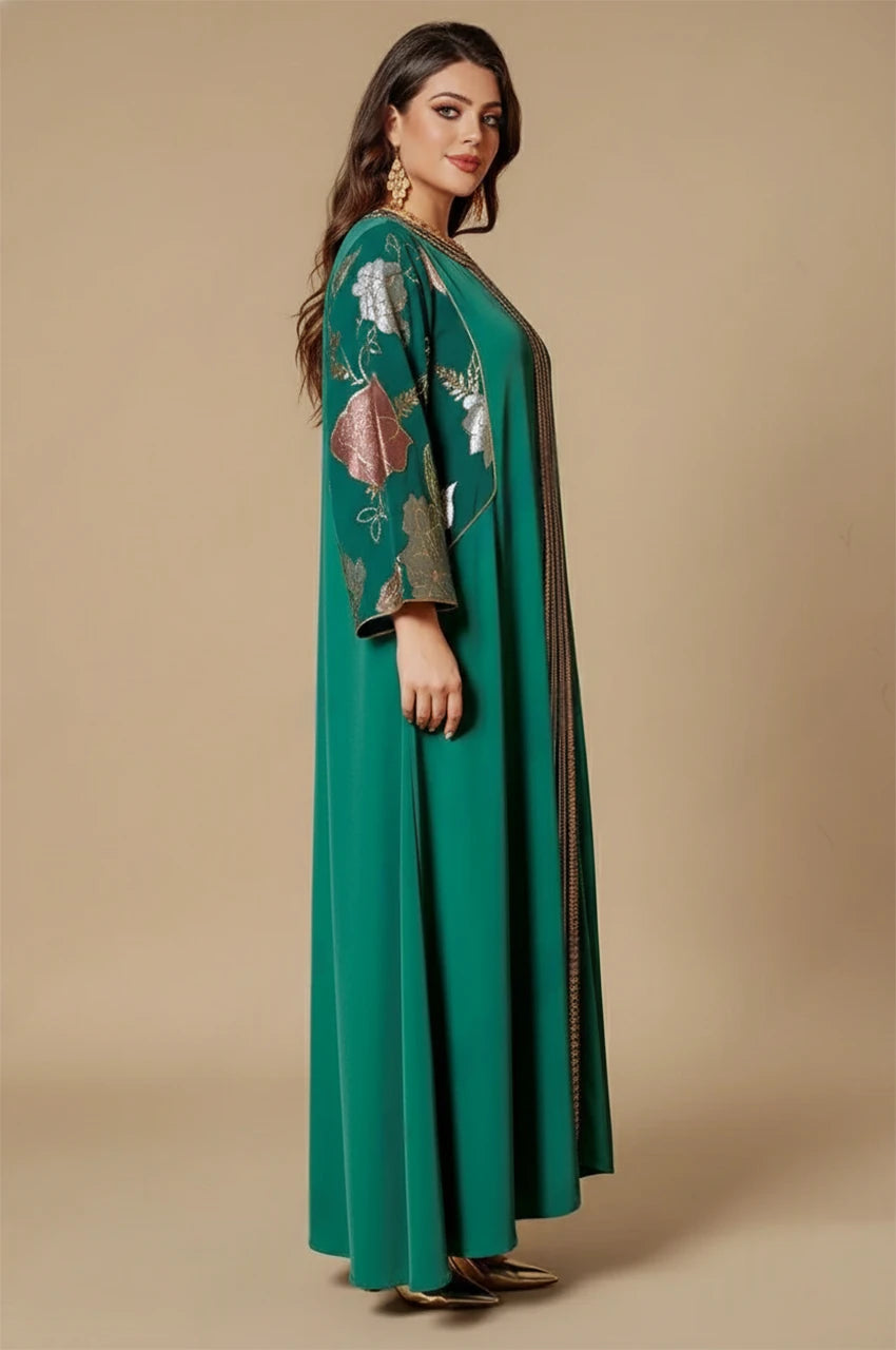 Side view of Samira green Pakistan kaftan showing metallic floral sleeves and draped fit