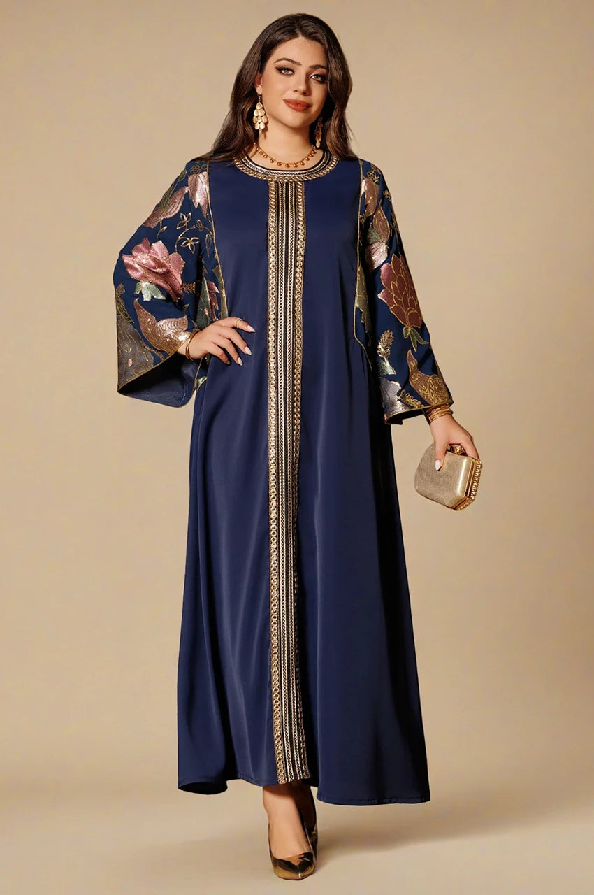 Samira royal blue Pakistan kaftan elegant front look styled with gold clutch and metallic floral sleeves