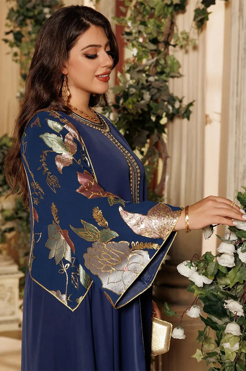 Samira Pakistan Kaftan in Royal Blue with floral metallic sleeves, elegant side pose, luxury modest fashion.